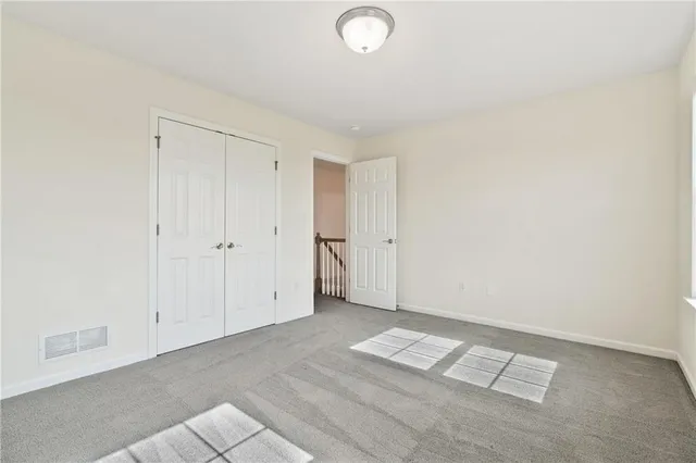 an empty room with white walls