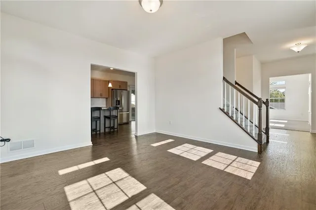 a view of an entryway with wooden floor
