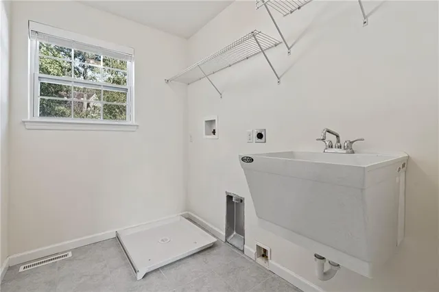 a bathroom with a sink and a window