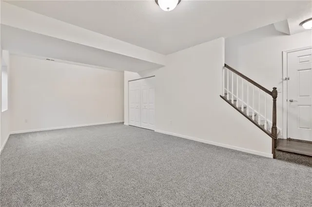 a view of an empty room with stairs
