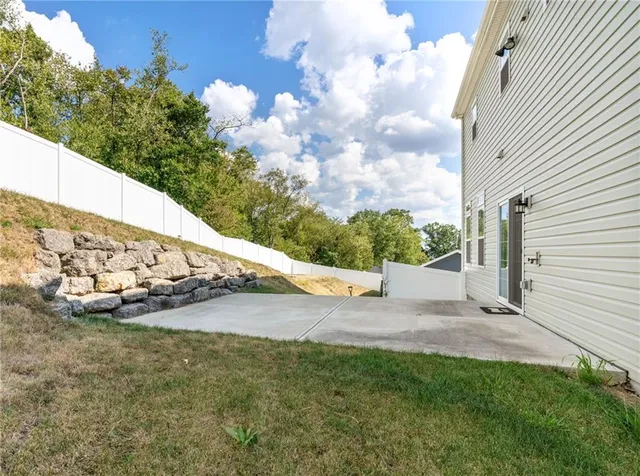 a view of a back yard of the house