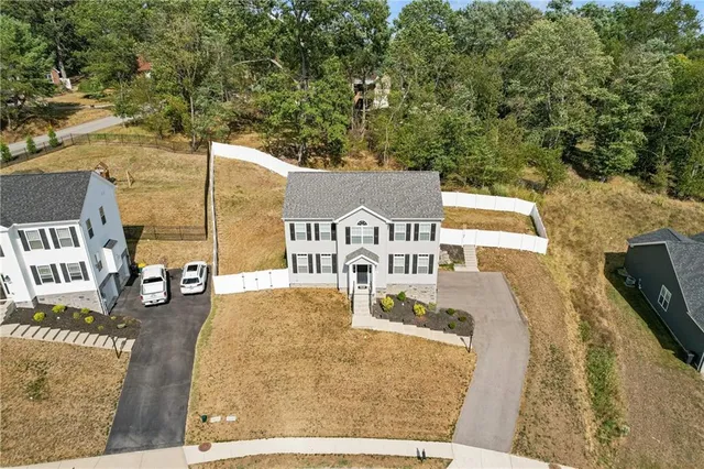 an aerial view of a house with a ocean view