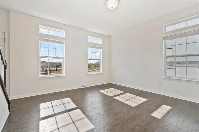 a view of an empty room with windows
