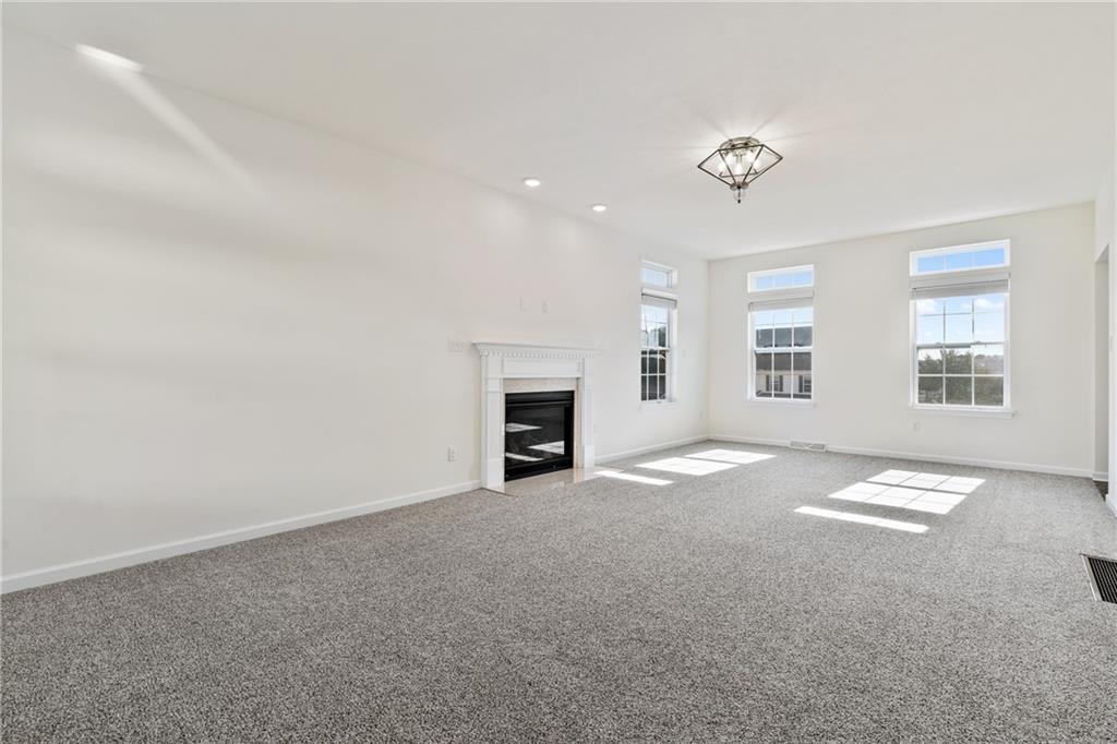 203 Southview Road Pittsburgh, PA 15237 - Photo 5 of 34 an empty room with windows and fireplace