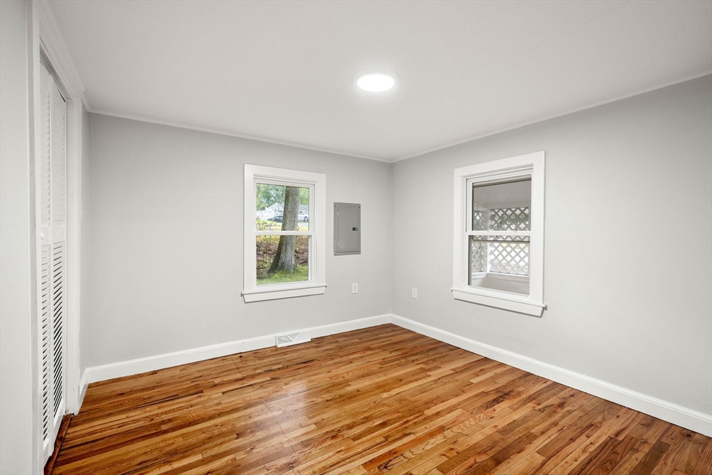 6 Leon Road Holbrook, MA 02343 - Photo 9 of 28 a view of an empty room with wooden floor and a window