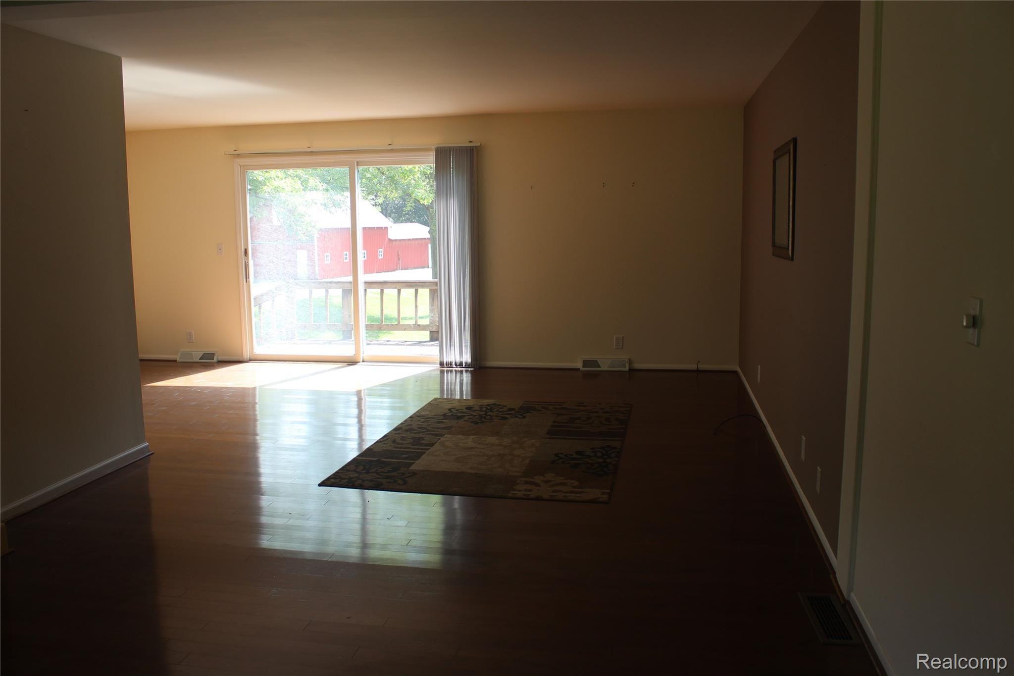 6095 Walsh Road Dexter, MI 48130 - Photo 17 of 35 Large family room with lots of light