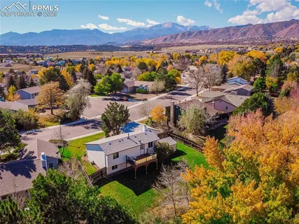 an aerial view of a house with a garden