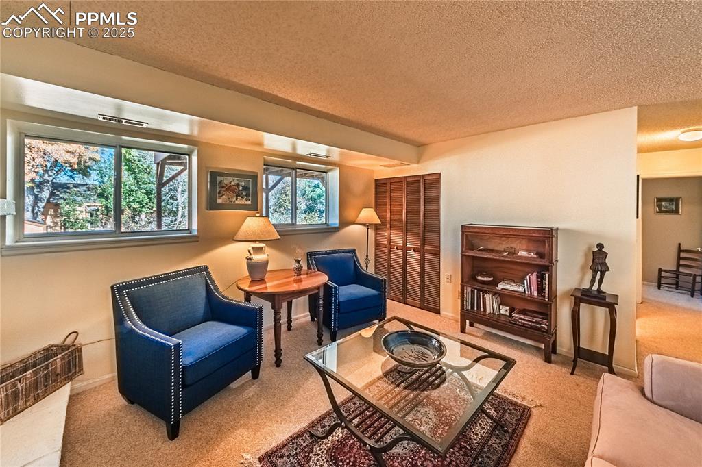 422 Saddlemountain Road Colorado Springs, CO 80919 - Photo 12 of 30 a living room with furniture and large window