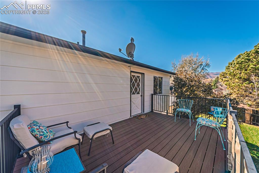 422 Saddlemountain Road Colorado Springs, CO 80919 - Photo 17 of 30 a view of outdoor seating space with wooden floor