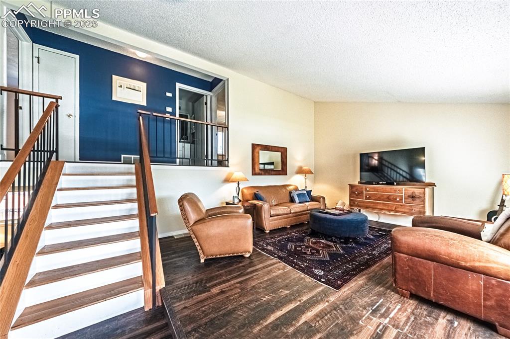 422 Saddlemountain Road Colorado Springs, CO 80919 - Photo 3 of 30 a living room with furniture and a flat screen tv