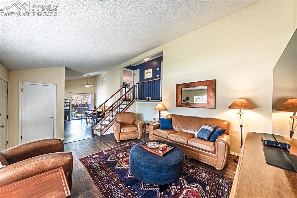 422 Saddlemountain Road Colorado Springs, CO 80919 - Photo 4 of 30 a living room with furniture and a wooden floor