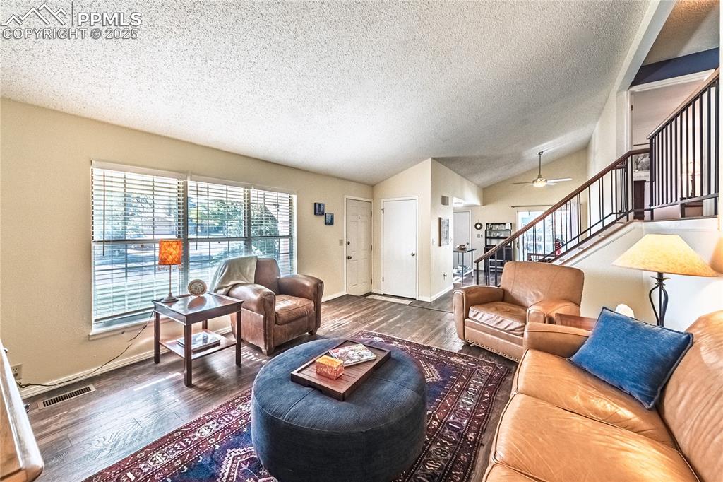 422 Saddlemountain Road Colorado Springs, CO 80919 - Photo 5 of 30 a living room with furniture and a floor to ceiling window