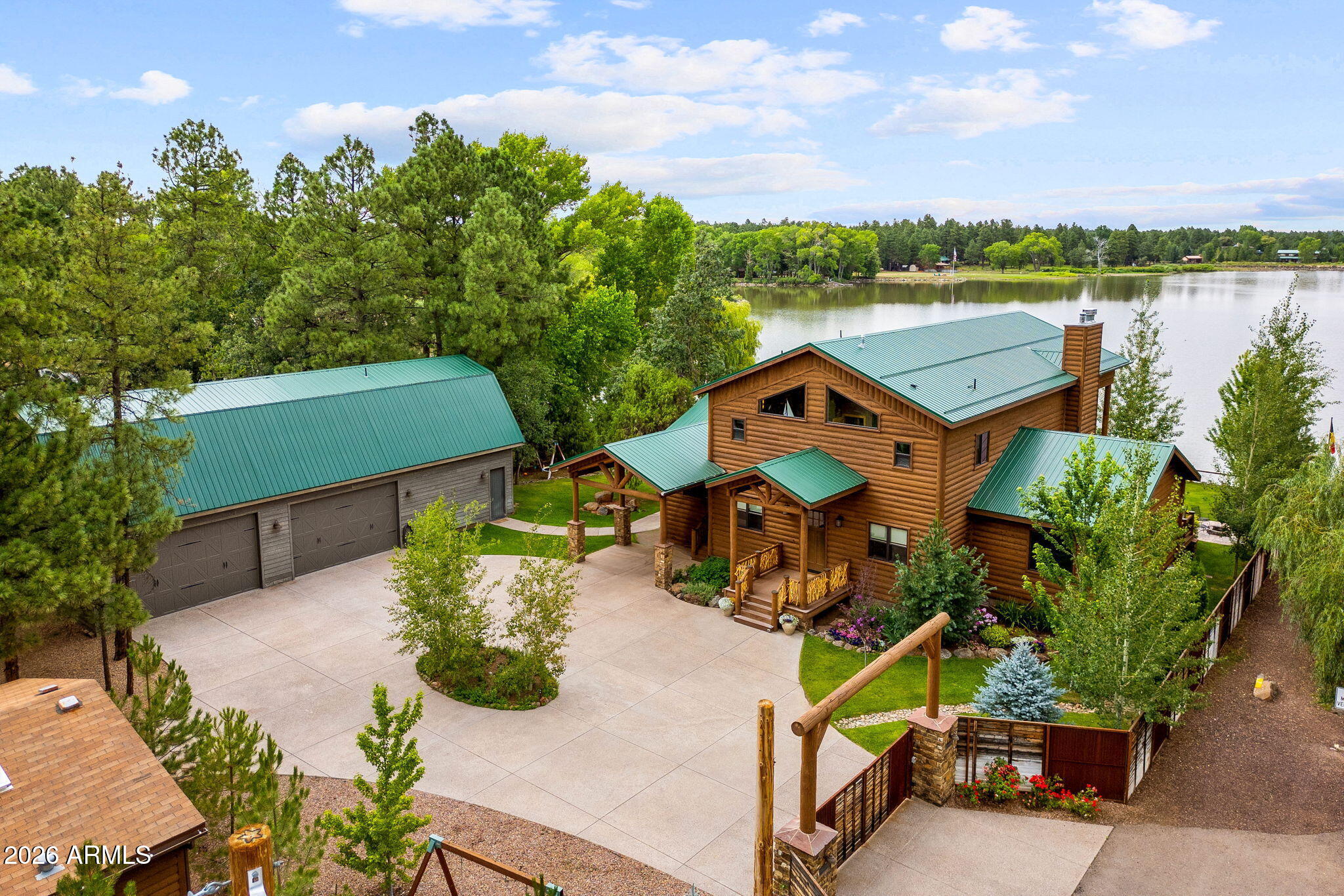 758 Southlake Road Lakeside, AZ 85929 - Photo 2 of 95 an aerial view of a house with a garden and lake view