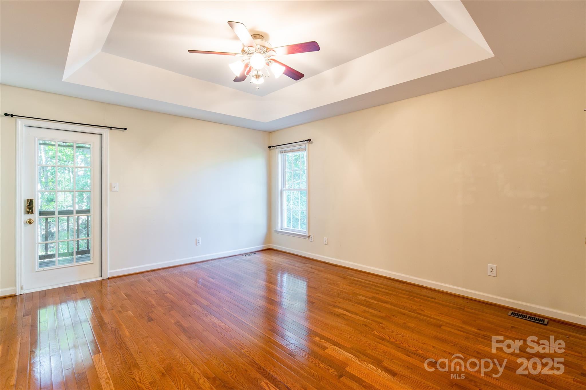 2177 Lookout Ridge Rock Hill, SC 29732 - Photo 14 of 34 a view of an empty room with wooden floor and a window