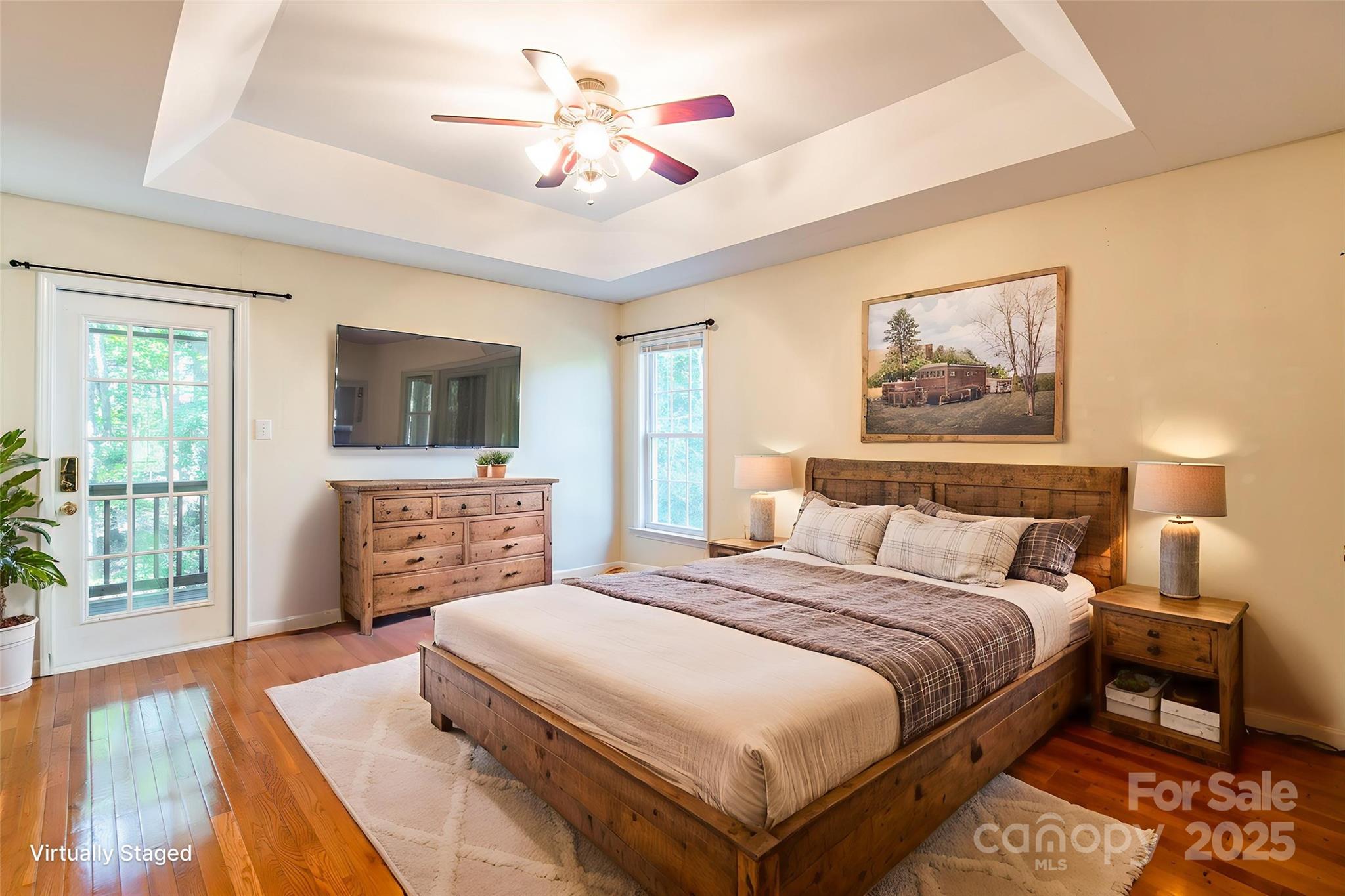 2177 Lookout Ridge Rock Hill, SC 29732 - Photo 21 of 46 a spacious bedroom with a bed a dresser and a flat screen tv