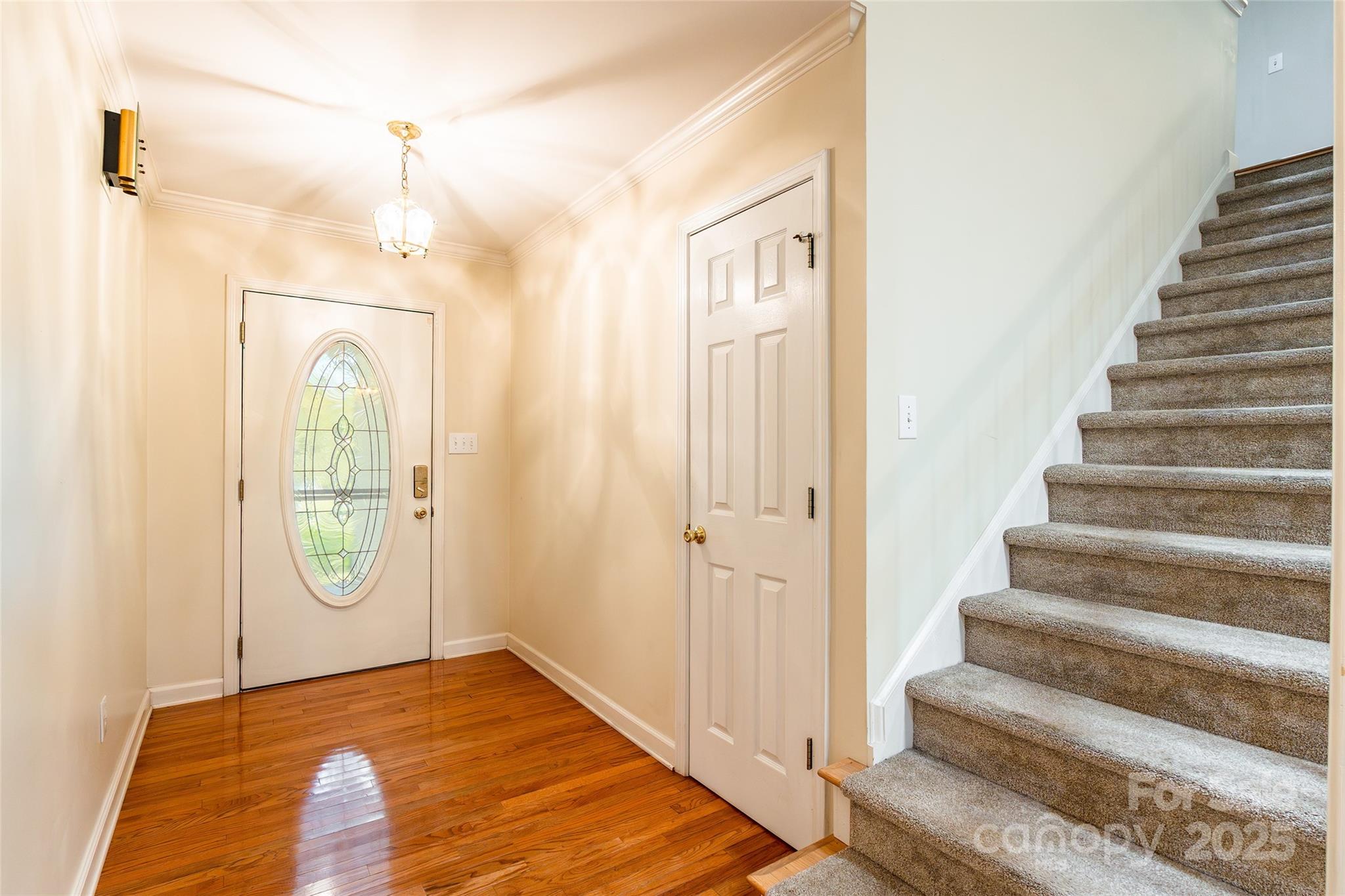 2177 Lookout Ridge Rock Hill, SC 29732 - Photo 5 of 46 a view of a hallway with entryway wooden floor and front door