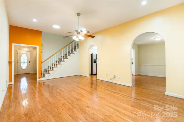 a view of an entryway with wooden floor