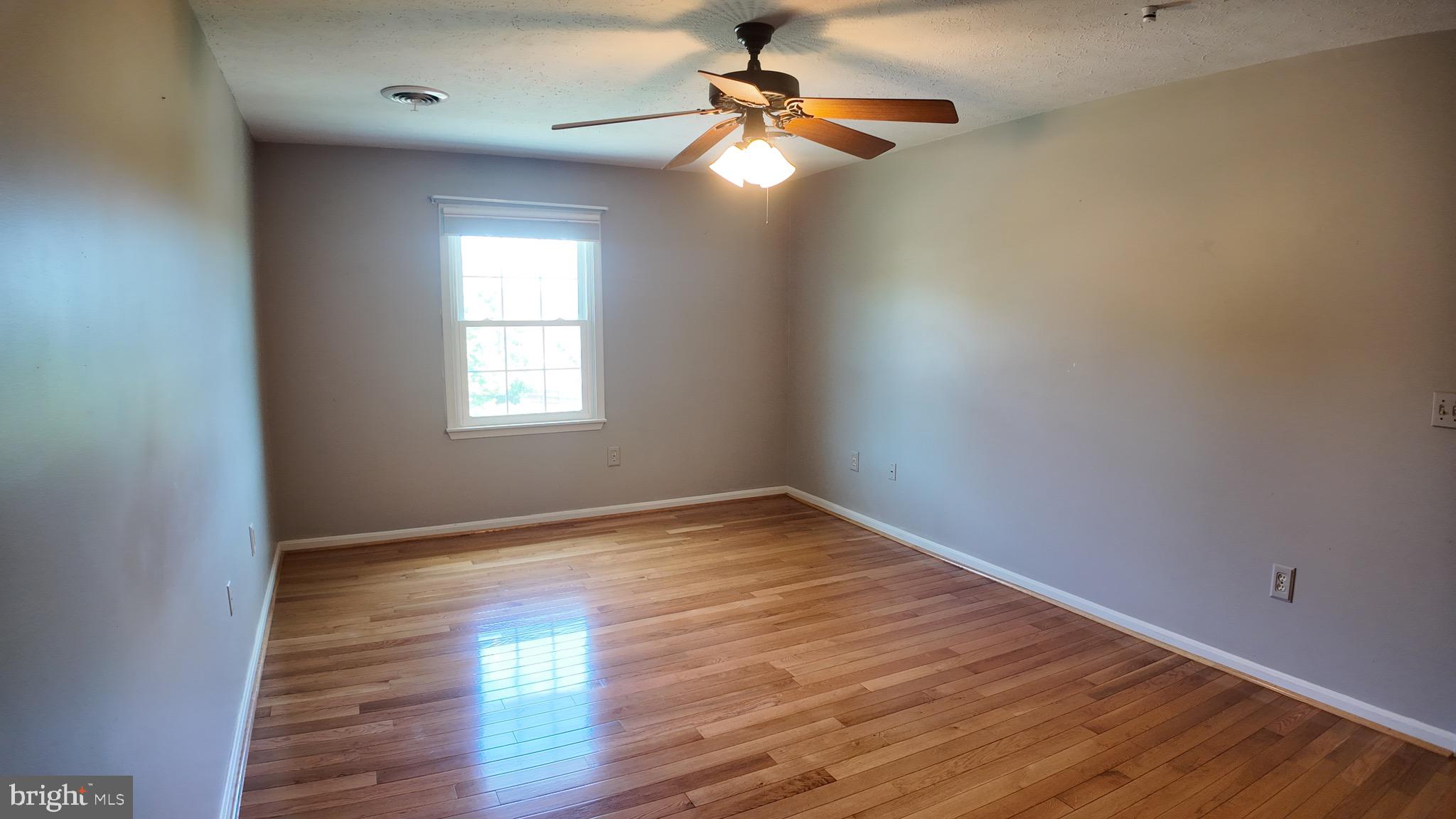 1185 Kesler Road Front Royal, VA 22630 - Photo 27 of 51 a view of empty room with wooden floor and fan