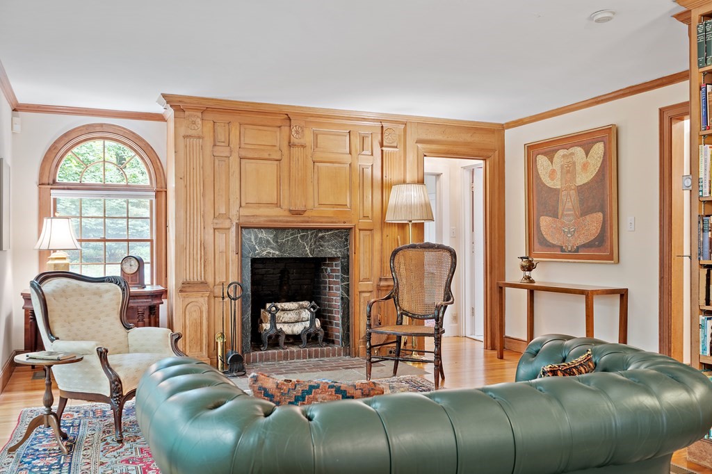 23 Bennington Road Lexington, MA 02421 - Photo 12 of 42 a living room with furniture fireplace and a large window