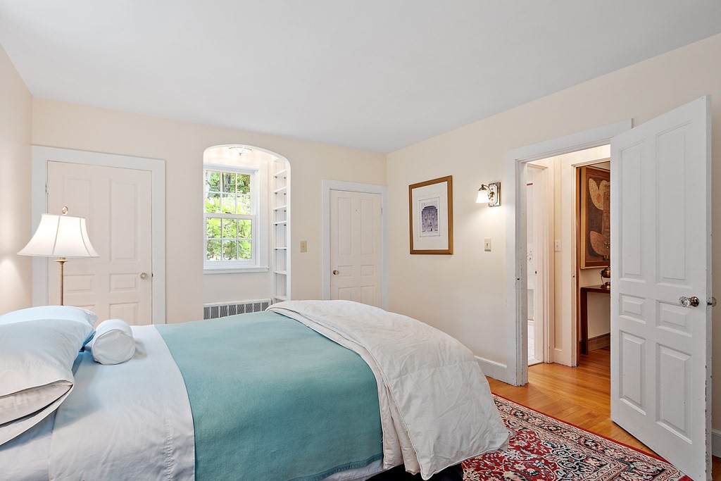 23 Bennington Road Lexington, MA 02421 - Photo 20 of 42 a bedroom with a bed and a window