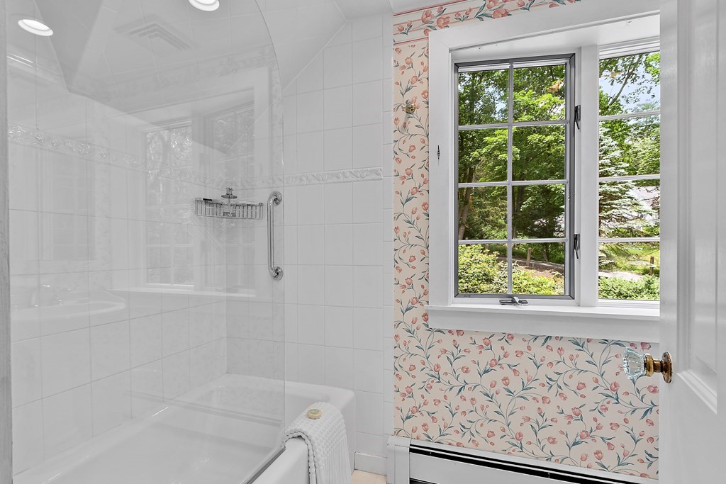 23 Bennington Road Lexington, MA 02421 - Photo 23 of 42 a bathroom with a bathtub and window