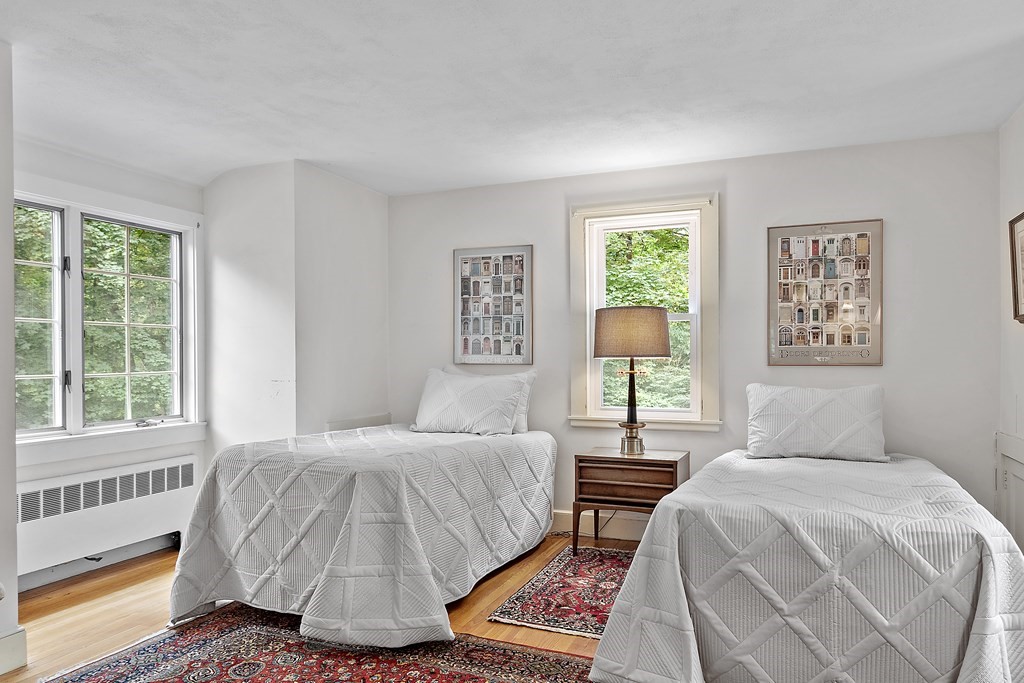 23 Bennington Road Lexington, MA 02421 - Photo 24 of 42 a bedroom with a bed lamp and a window