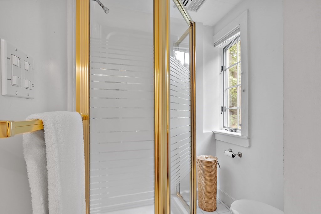 23 Bennington Road Lexington, MA 02421 - Photo 26 of 42 a bathroom with a shower and toilet