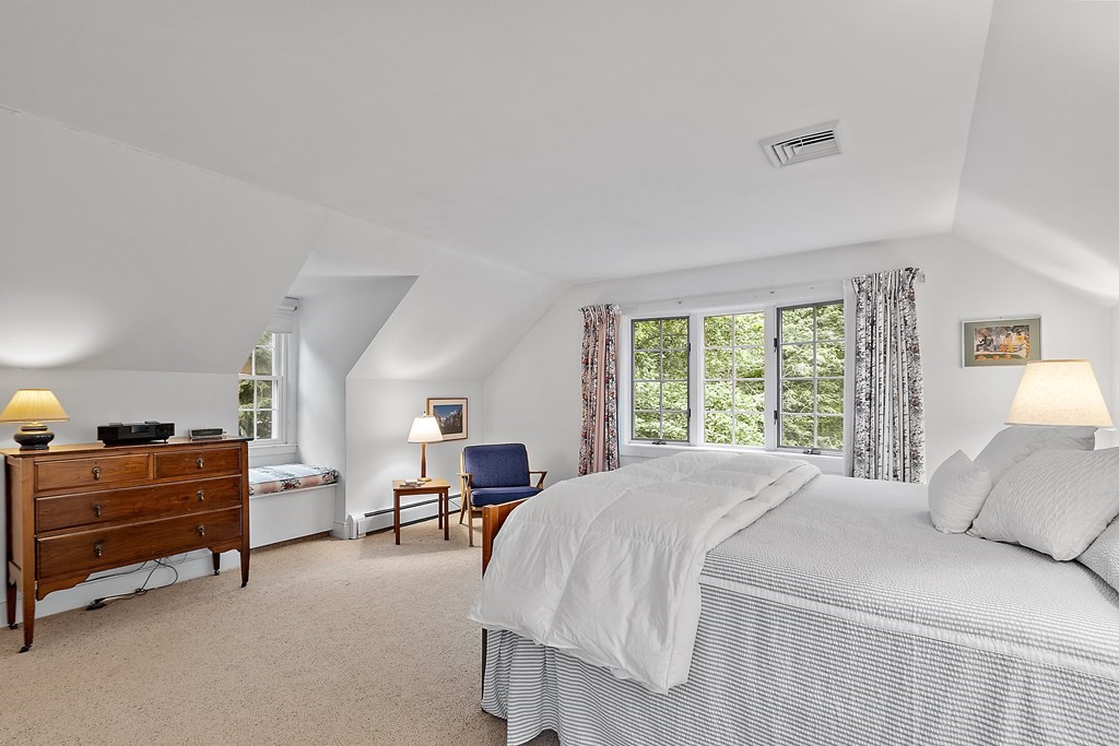 23 Bennington Road Lexington, MA 02421 - Photo 31 of 42 a bedroom with a bed and window