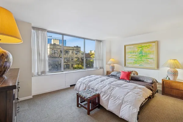 a bed room with a bed and a window