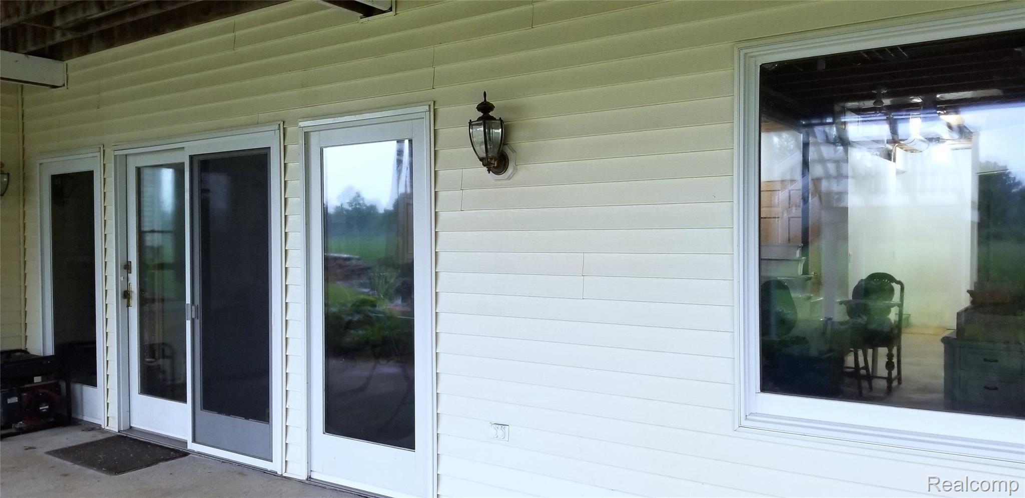 5800 Milett Road Fowlerville, MI 48836 - Photo 49 of 52 Large windows in Walkout
