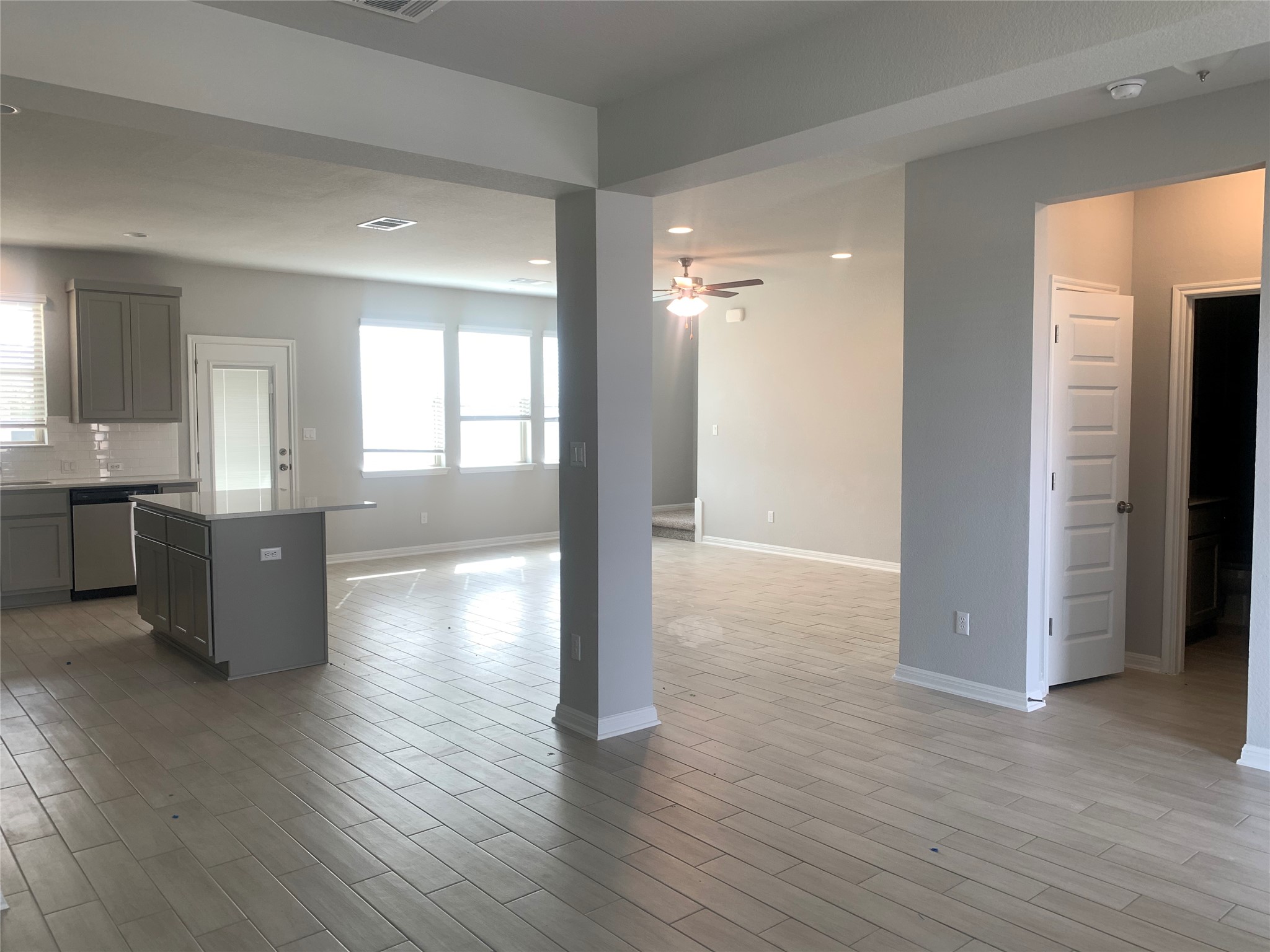 2948 Sage Ranch Drive Leander, TX 78641 - Photo 28 of 28 An open floorplan seamlessly connects the kitchen and living areas, offering effortless movement and abundant natural illumination.