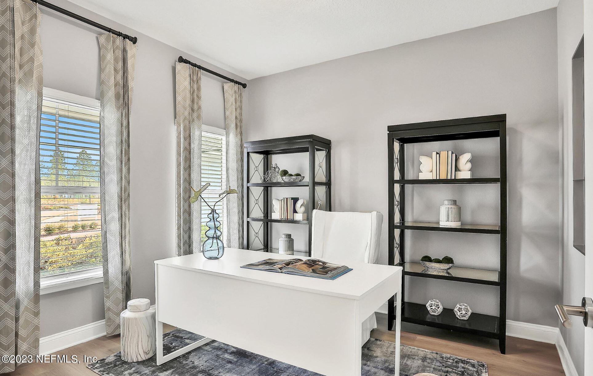 76 Archstone Way St. Augustine, FL 32092 - Photo 11 of 49 a living room with hard wood floor and a window