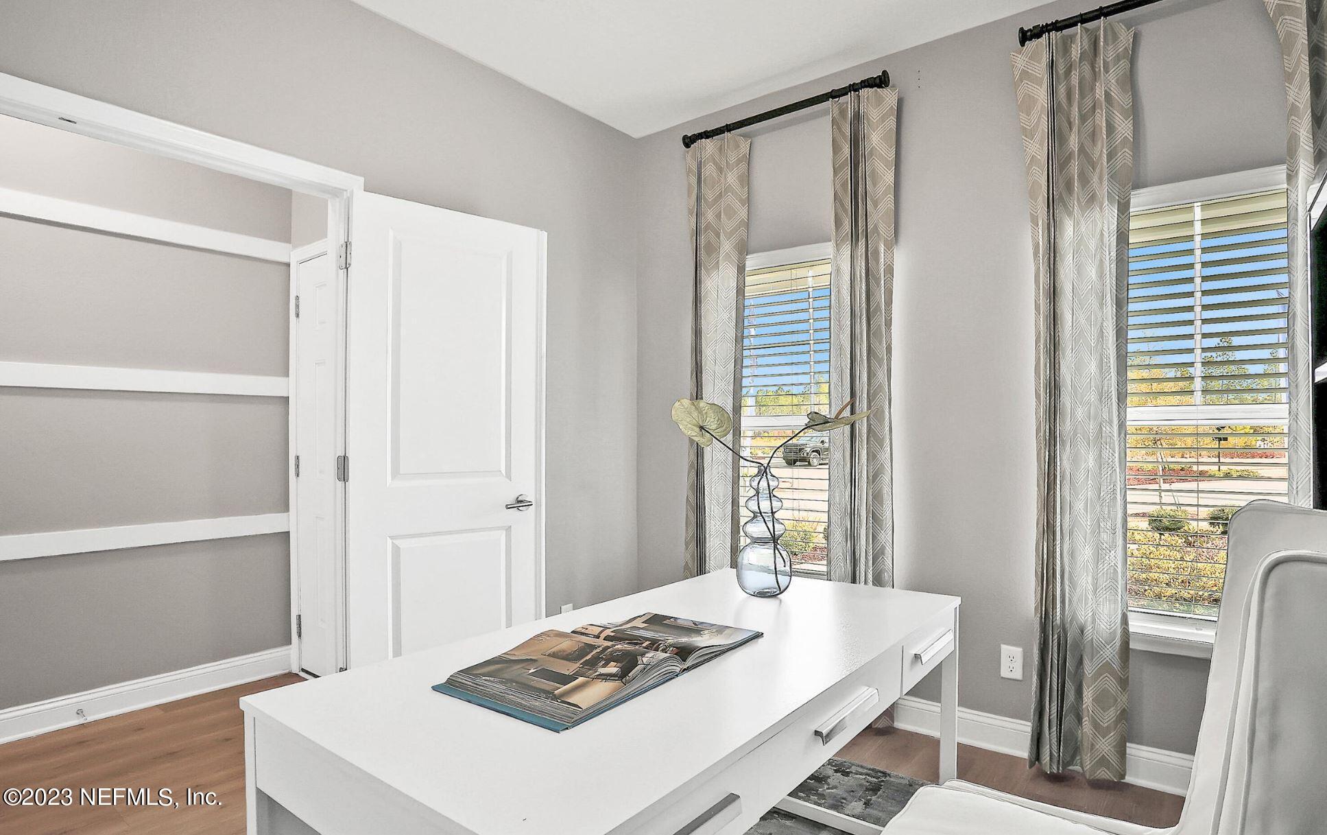 76 Archstone Way St. Augustine, FL 32092 - Photo 12 of 49 a dining room with a table and chairs