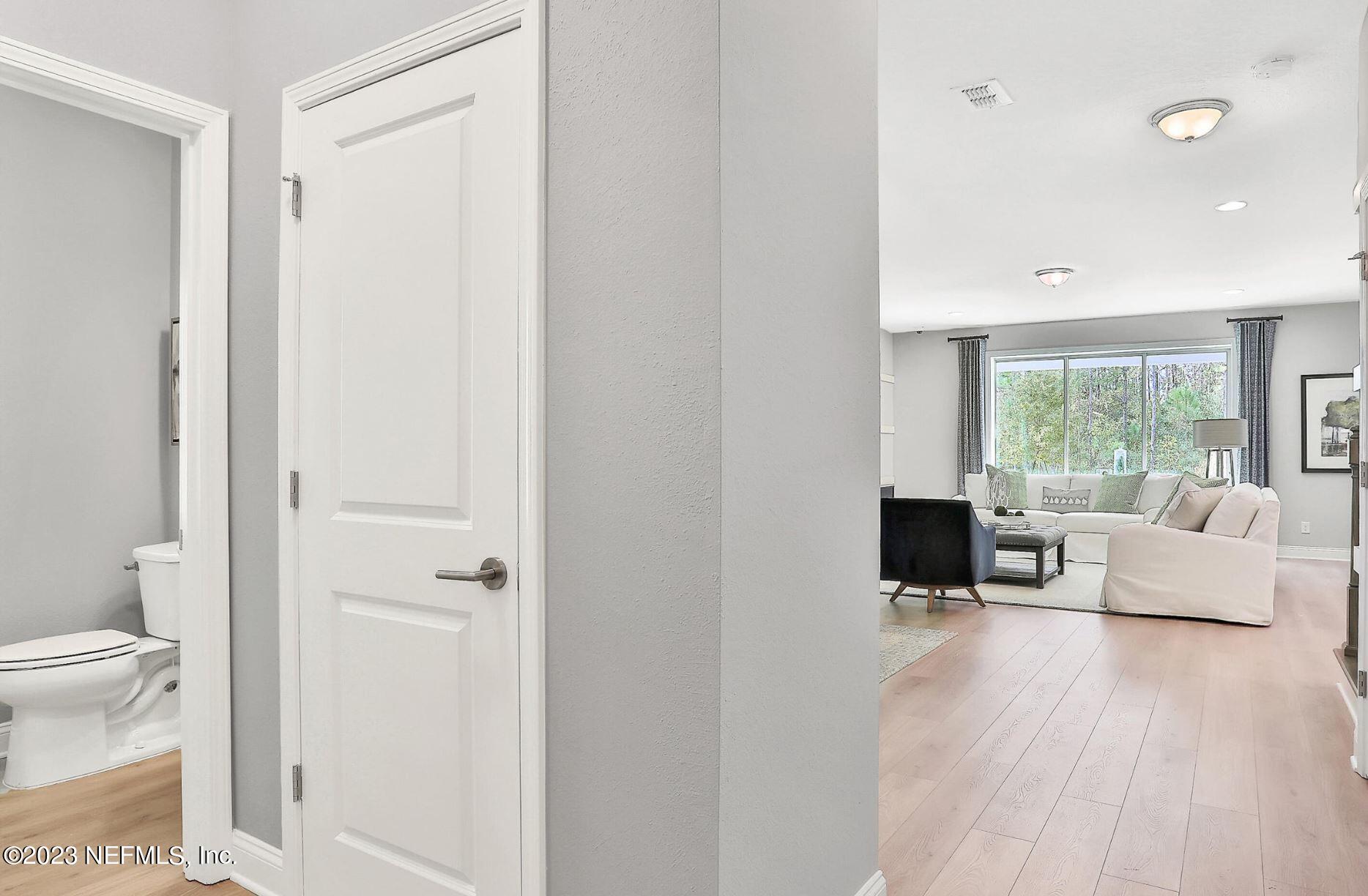 76 Archstone Way St. Augustine, FL 32092 - Photo 13 of 49 a living room with furniture and a large window