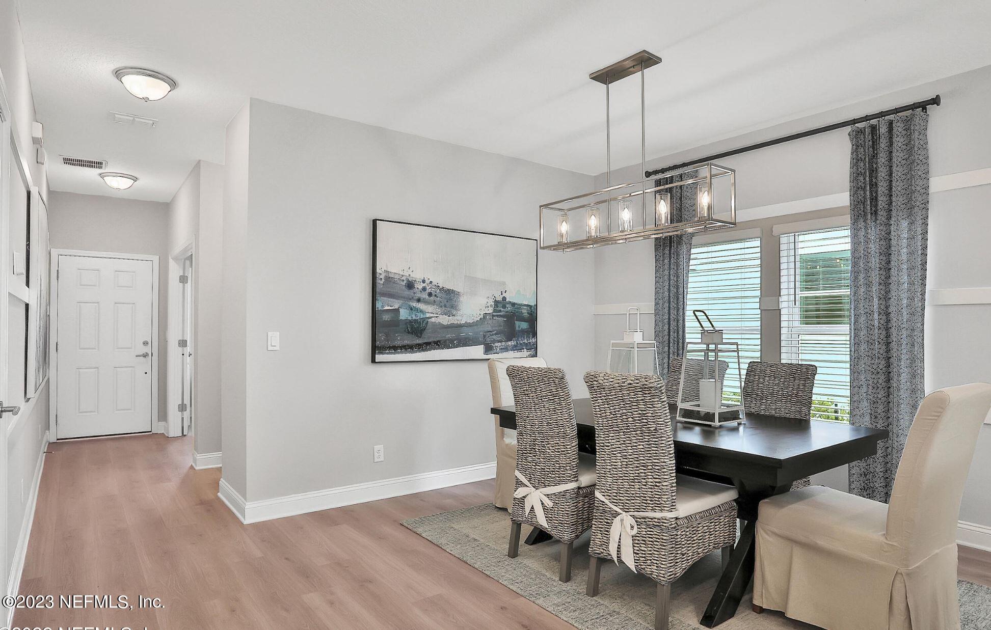 76 Archstone Way St. Augustine, FL 32092 - Photo 16 of 49 a view of a dining room with furniture window and wooden floor