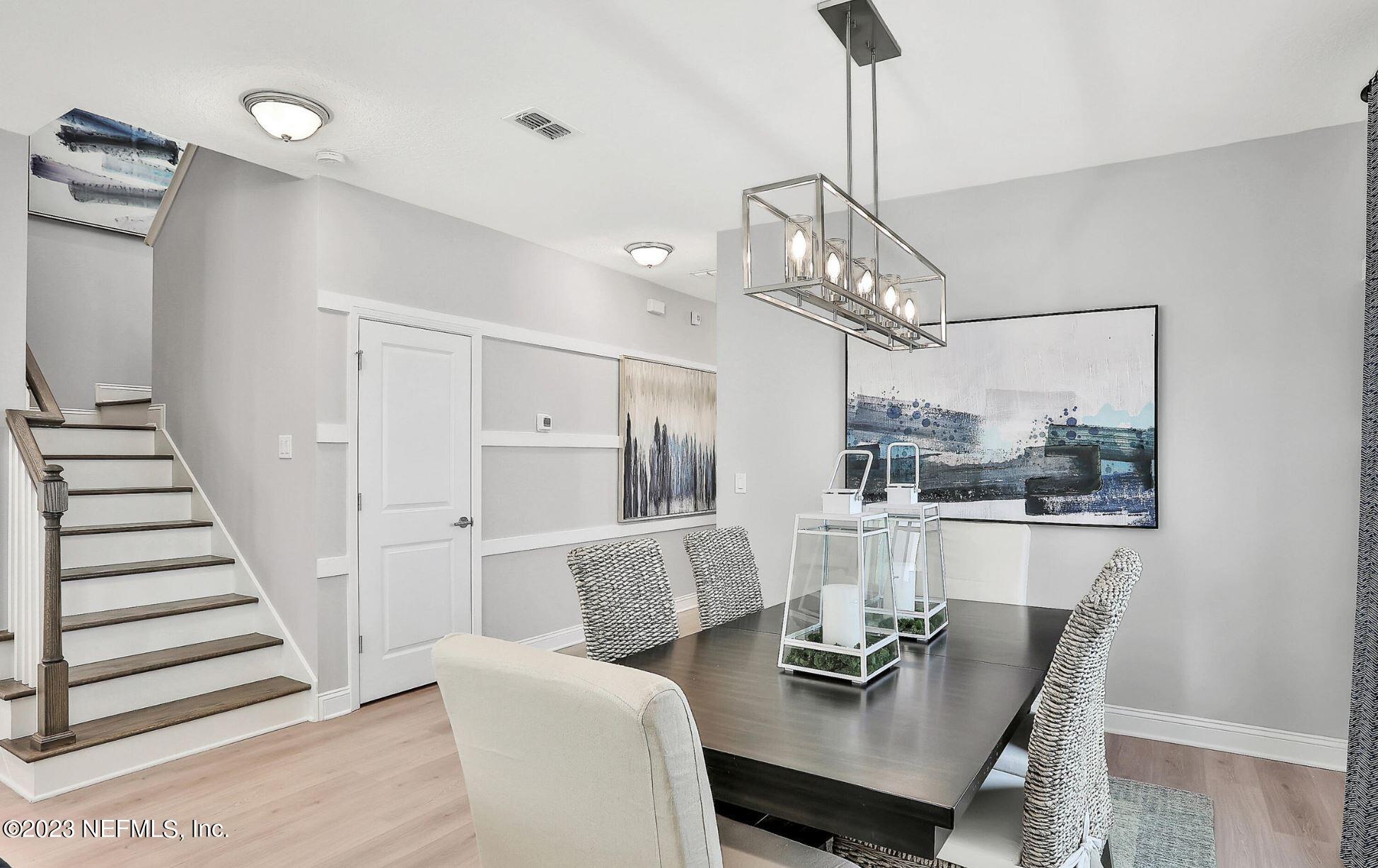 76 Archstone Way St. Augustine, FL 32092 - Photo 17 of 49 a view of a dining room with furniture and wooden floor