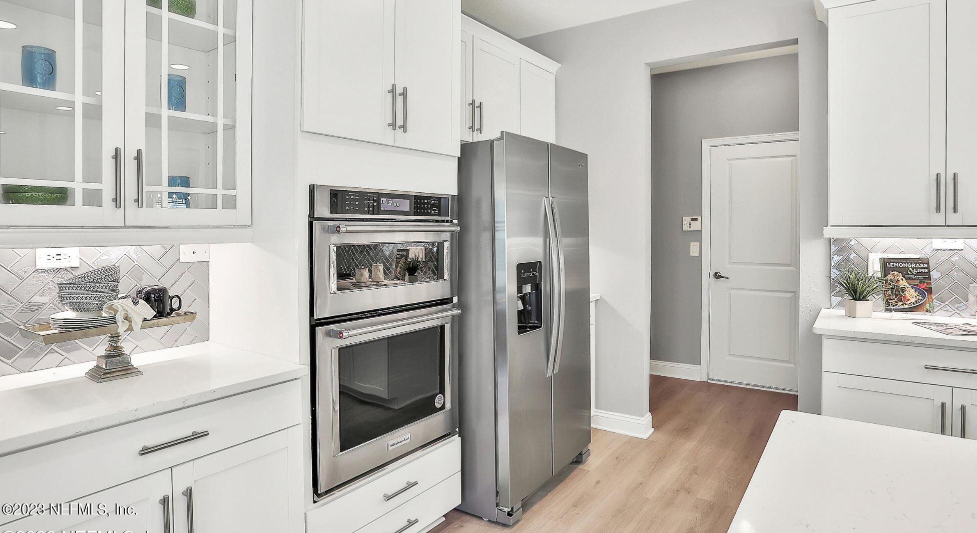 76 Archstone Way St. Augustine, FL 32092 - Photo 29 of 49 a kitchen with stainless steel appliances a refrigerator stove and sink