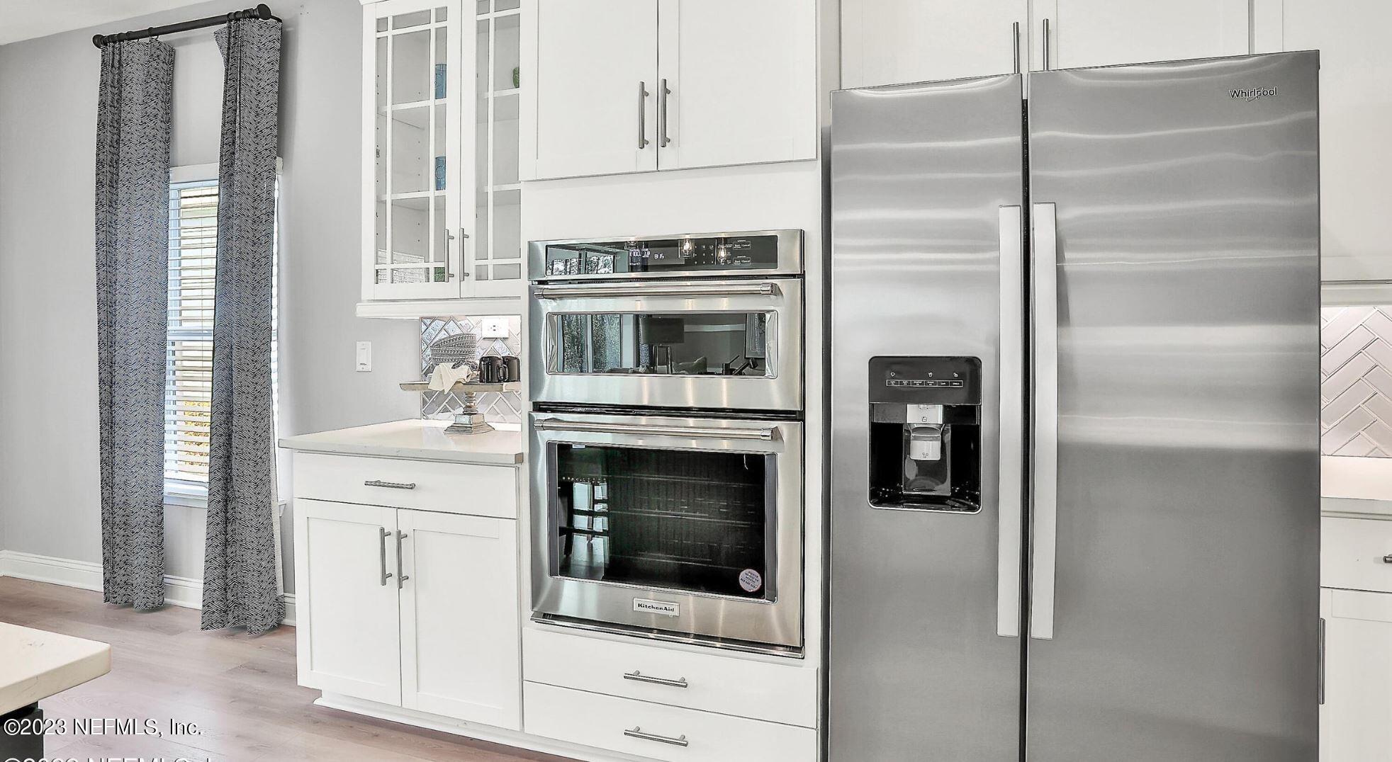 76 Archstone Way St. Augustine, FL 32092 - Photo 30 of 49 a kitchen with cabinets and stainless steel appliances