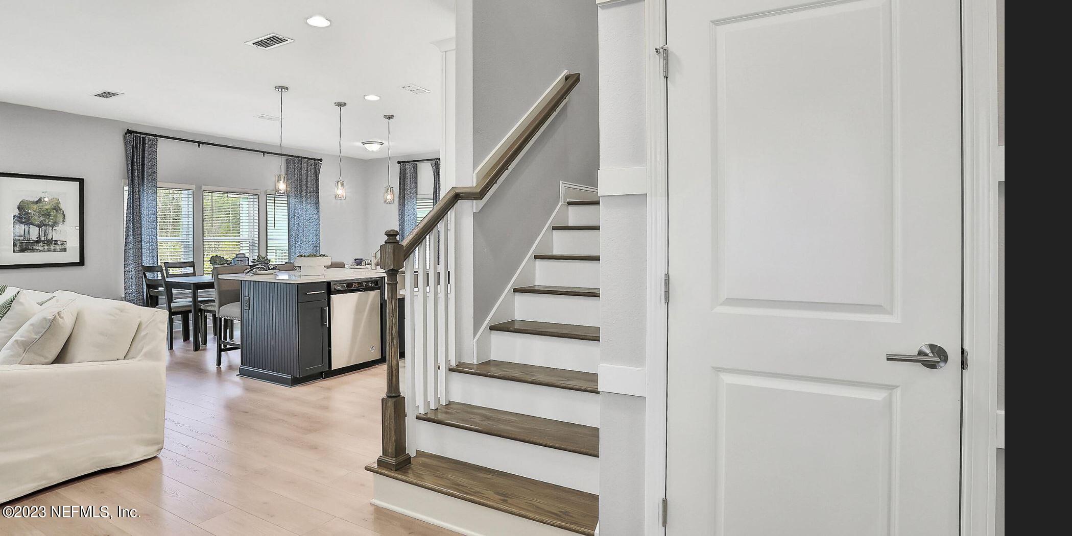76 Archstone Way St. Augustine, FL 32092 - Photo 31 of 49 a view of entryway and hall with wooden floor