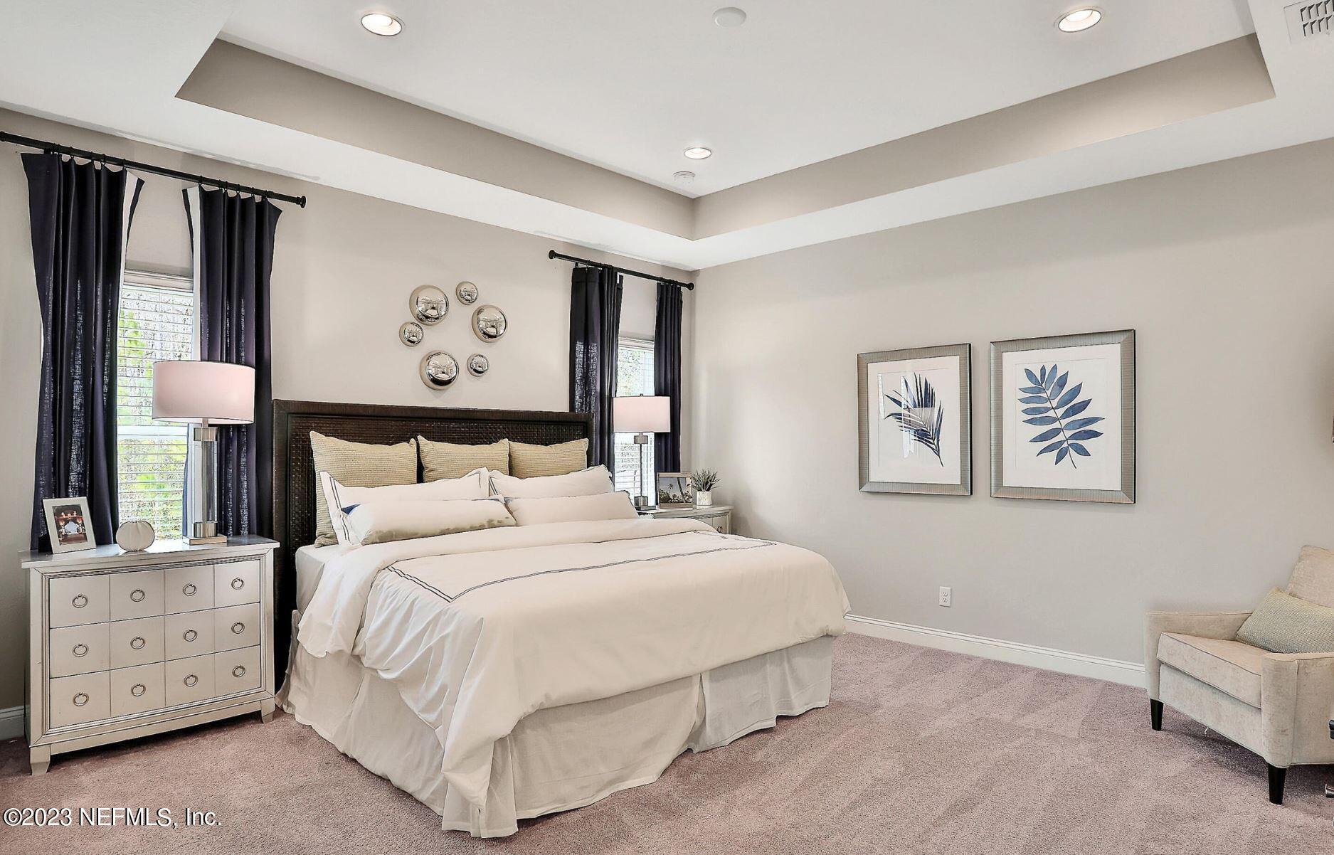 76 Archstone Way St. Augustine, FL 32092 - Photo 33 of 49 a bedroom with a bed and a painting on the wall