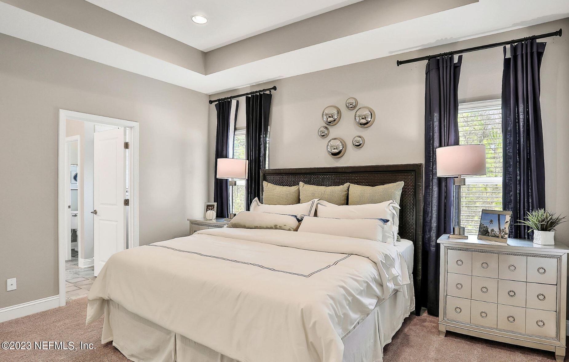 76 Archstone Way St. Augustine, FL 32092 - Photo 35 of 49 a bedroom with a bed and a dresser