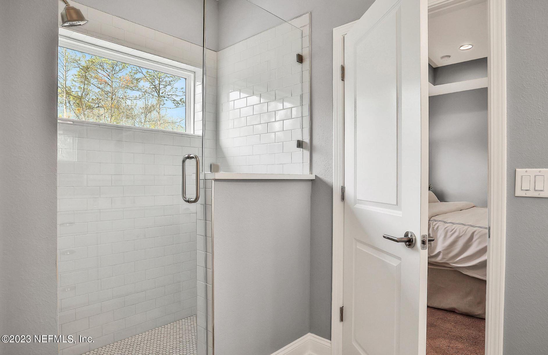 76 Archstone Way St. Augustine, FL 32092 - Photo 38 of 49 a bathroom with a shower