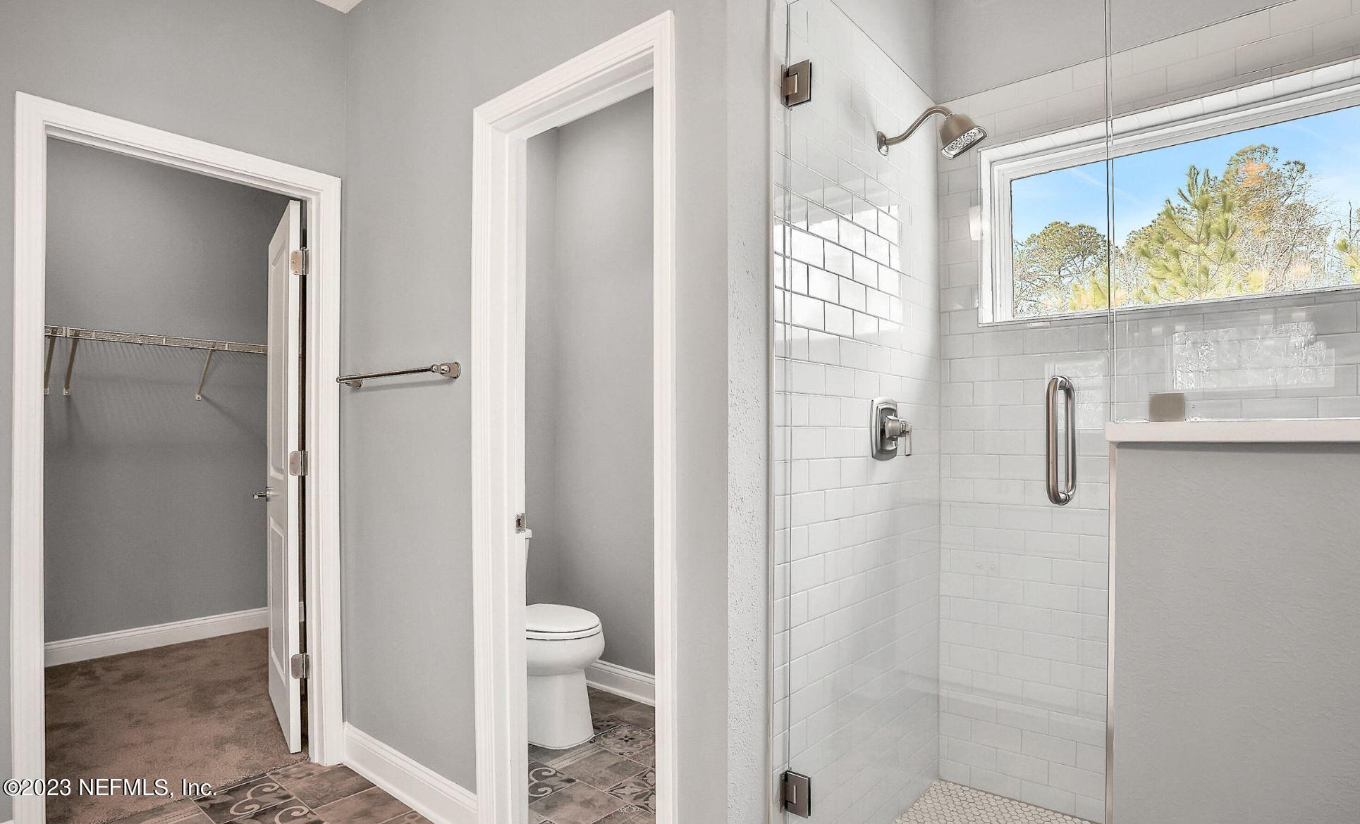 76 Archstone Way St. Augustine, FL 32092 - Photo 39 of 49 a bathroom with a shower and toilet