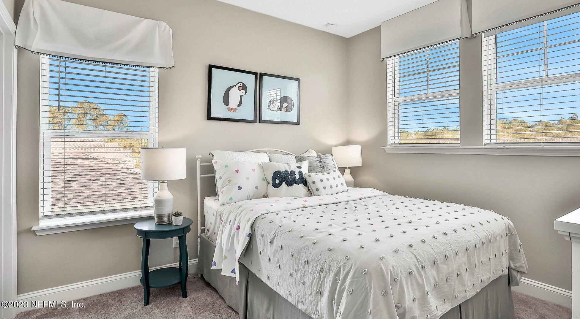 76 Archstone Way St. Augustine, FL 32092 - Photo 40 of 49 a bedroom with a bed and a window