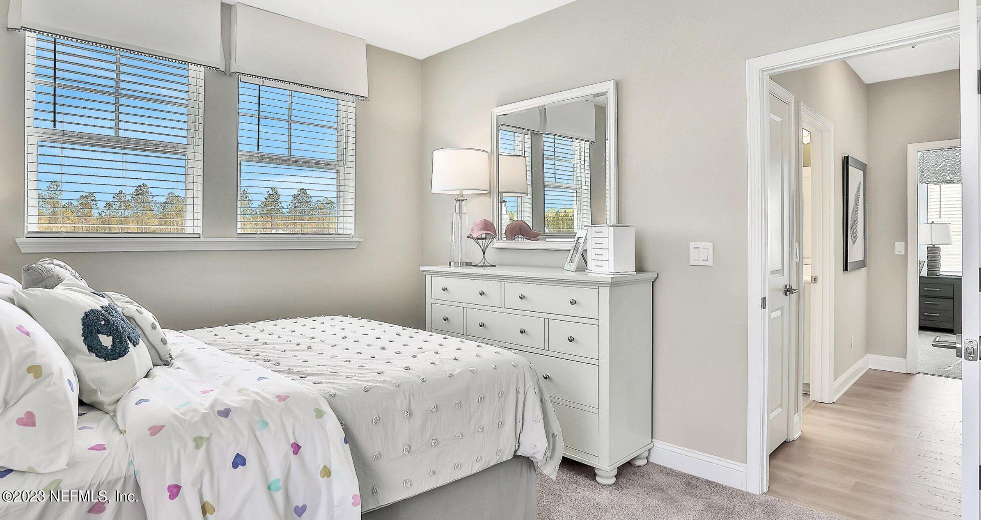 76 Archstone Way St. Augustine, FL 32092 - Photo 41 of 49 a bedroom with a bed and a dresser