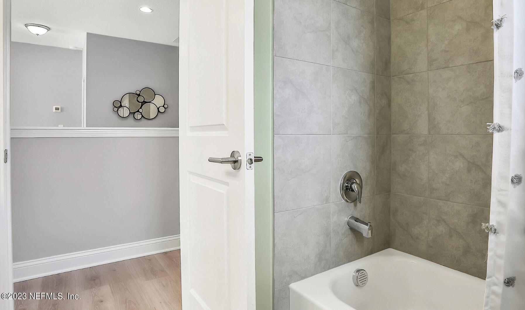 76 Archstone Way St. Augustine, FL 32092 - Photo 44 of 49 a bathroom with a bathtub and shower