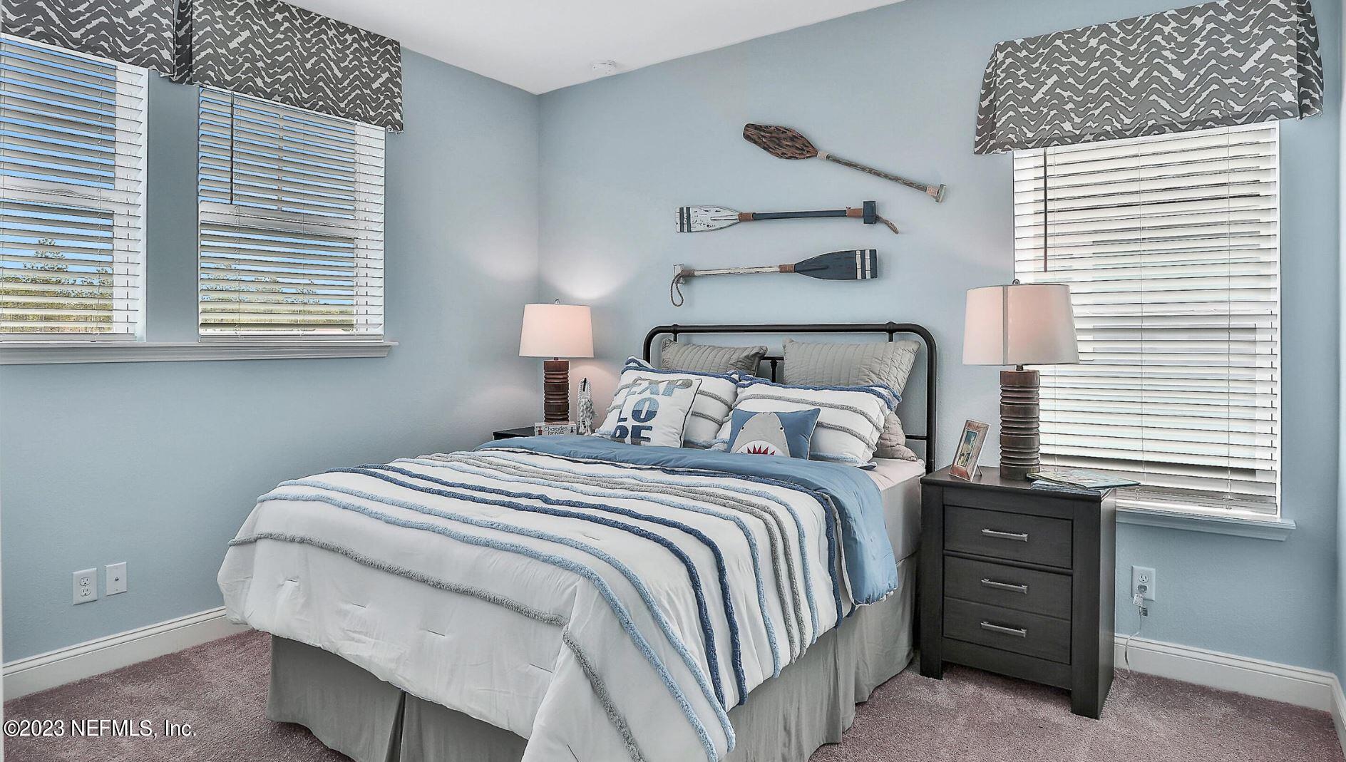 76 Archstone Way St. Augustine, FL 32092 - Photo 45 of 49 a bedroom with a bed and a window