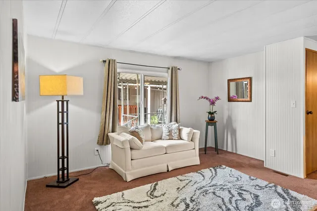 a bathroom with a sink vanity mirror and toilet