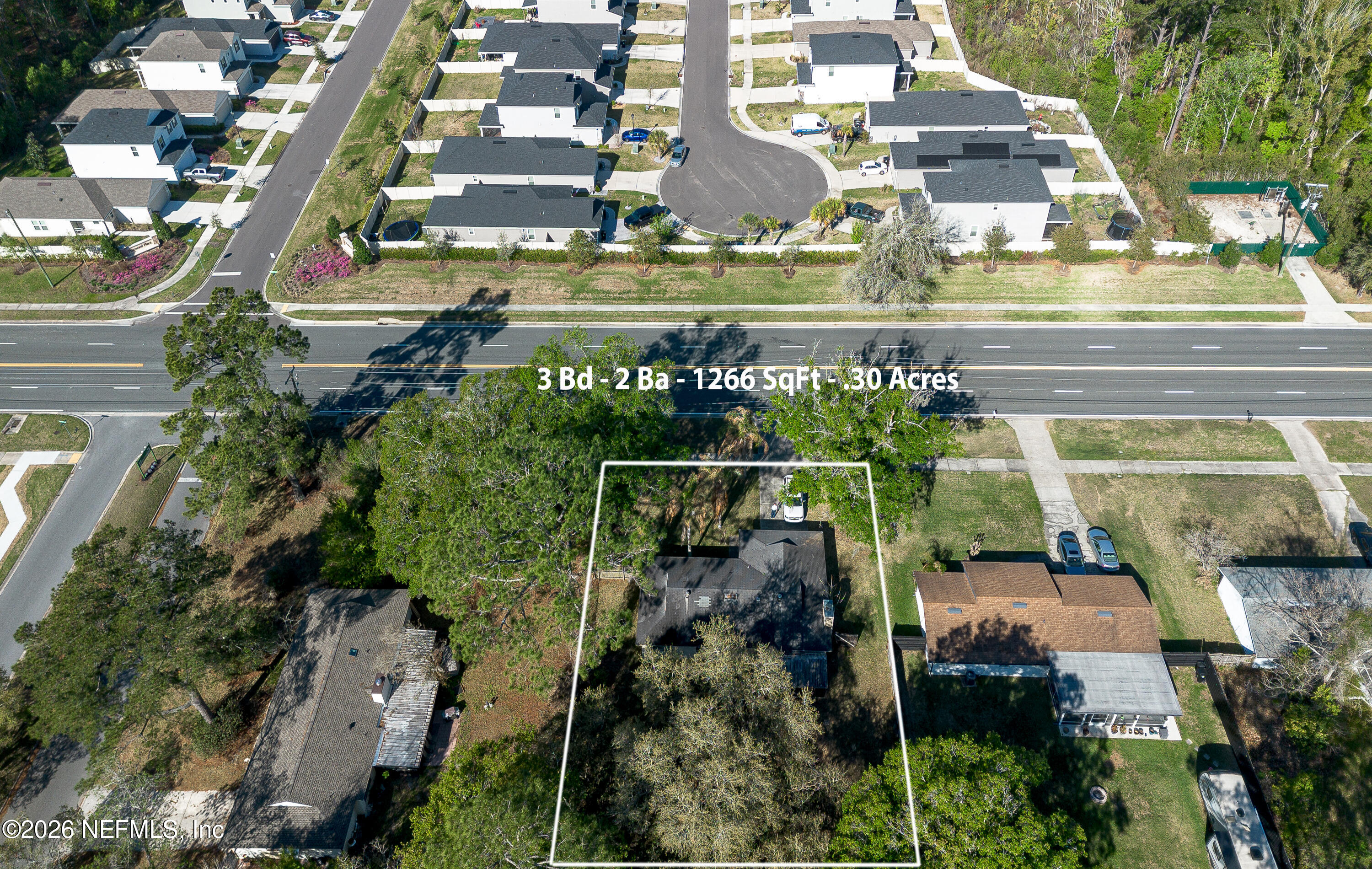 147 Knight Boxx Road Middleburg, FL 32068 - Photo 27 of 30 an aerial view of a building with outdoor space