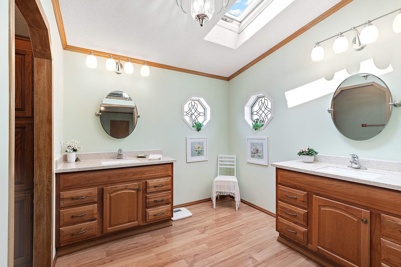 44 Petunia Circle Matteson, IL 60443 - Photo 14 of 20 a bathroom with a double vanity sink and a mirror